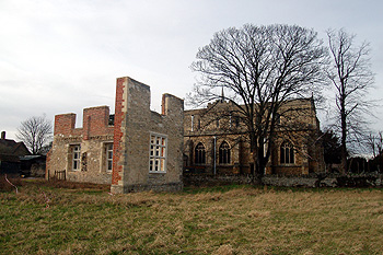 Remains of the Hillersdon mansion with the church behind February 2012